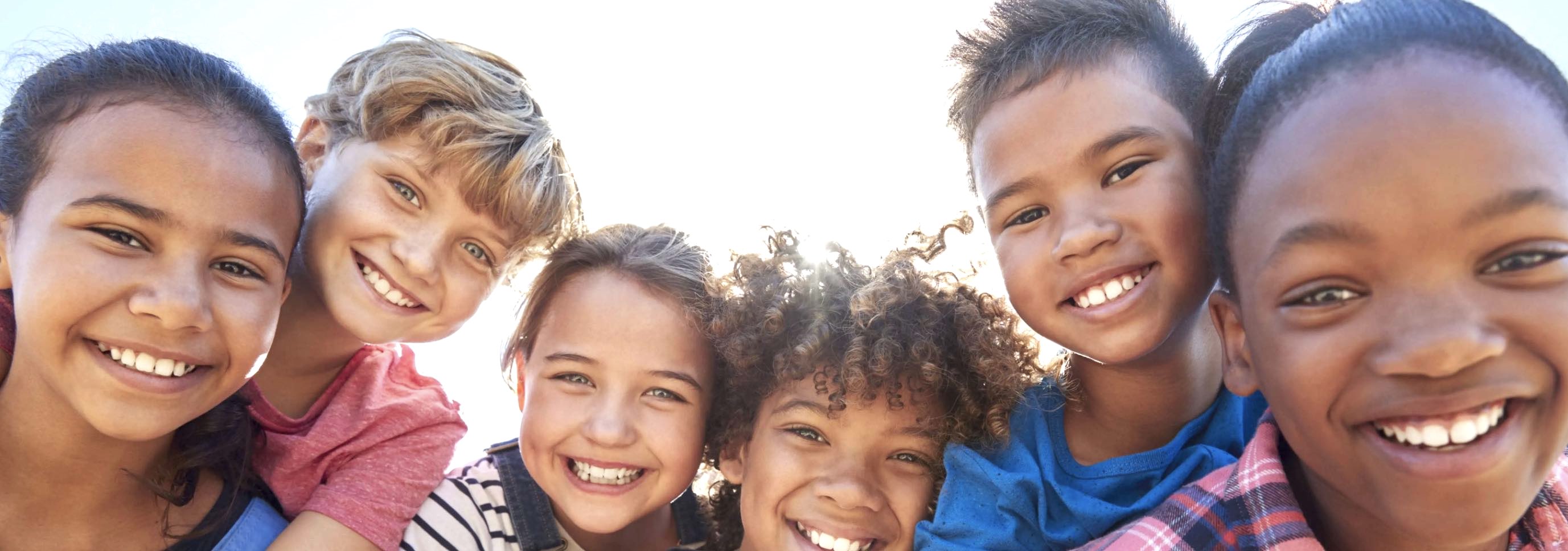 An image a diverse group of kids smiling